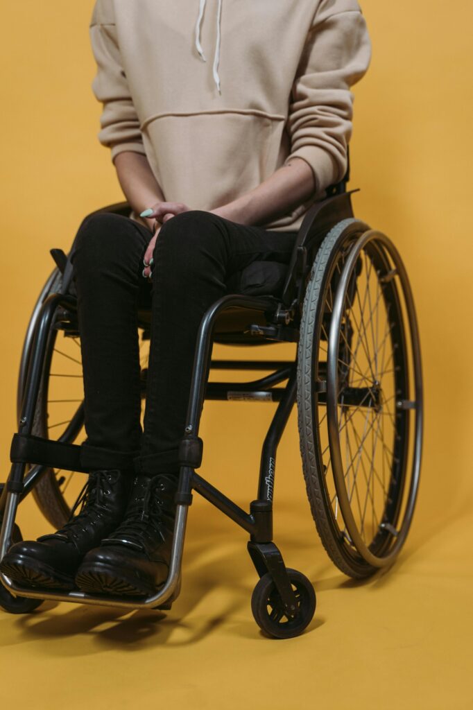 Below shoulder image of a person in a wheelchair.